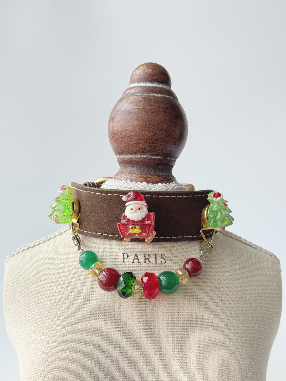 Pawlsle Trails Handmade Christmas-themed microfiber leather crystal pet collar, featuring Santa Claus and Christmas tree charms.