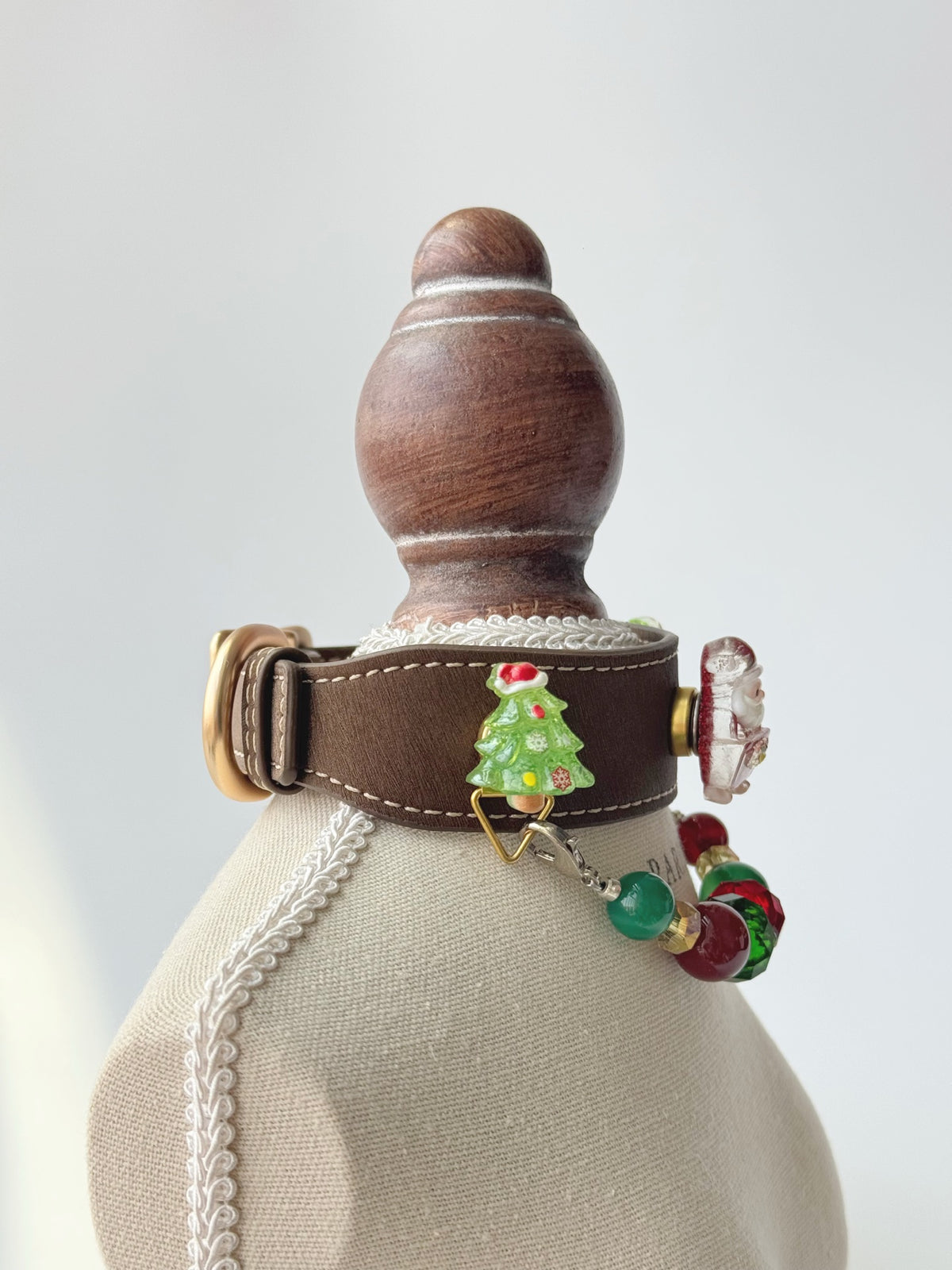 Pawlsle Trails Handmade Christmas-themed microfiber leather crystal pet collar, featuring Santa Claus and Christmas tree charms.