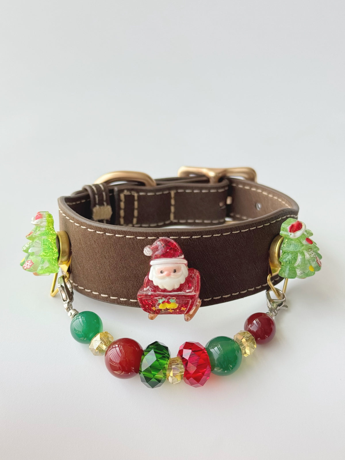 Pawlsle Trails Handmade Christmas-themed microfiber leather crystal pet collar, featuring Santa Claus and Christmas tree charms.