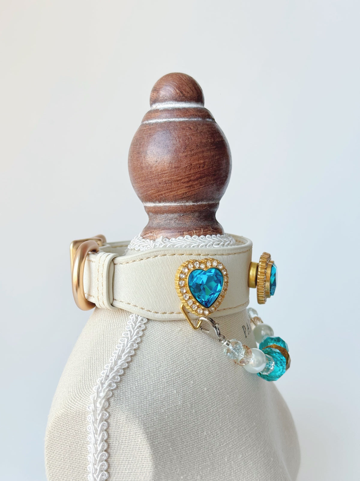 Pawlsle Trails Luxurious "Heart of the Ocean" crystal pet collar—an elegant white microfiber collar adorned with beaded gemstones.
