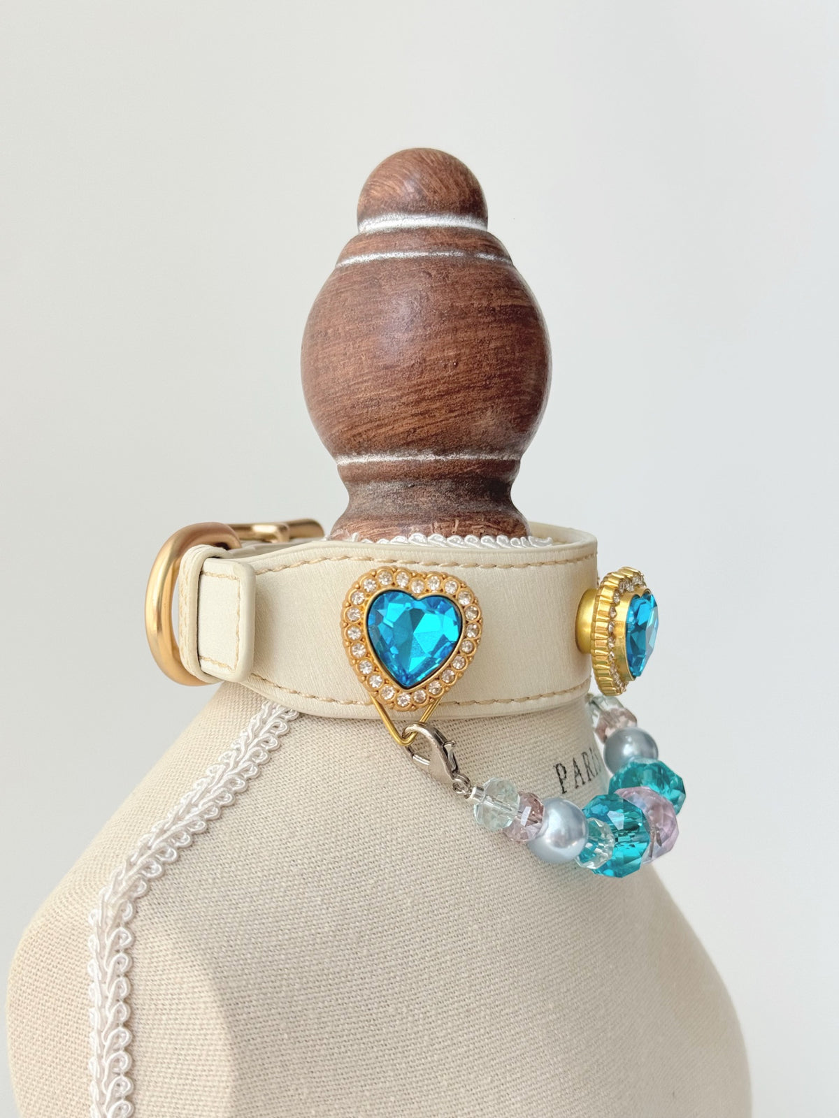 Pawlsle Trails Luxurious "Heart of the Ocean" crystal pet collar—an elegant white microfiber collar adorned with beaded gemstones.
