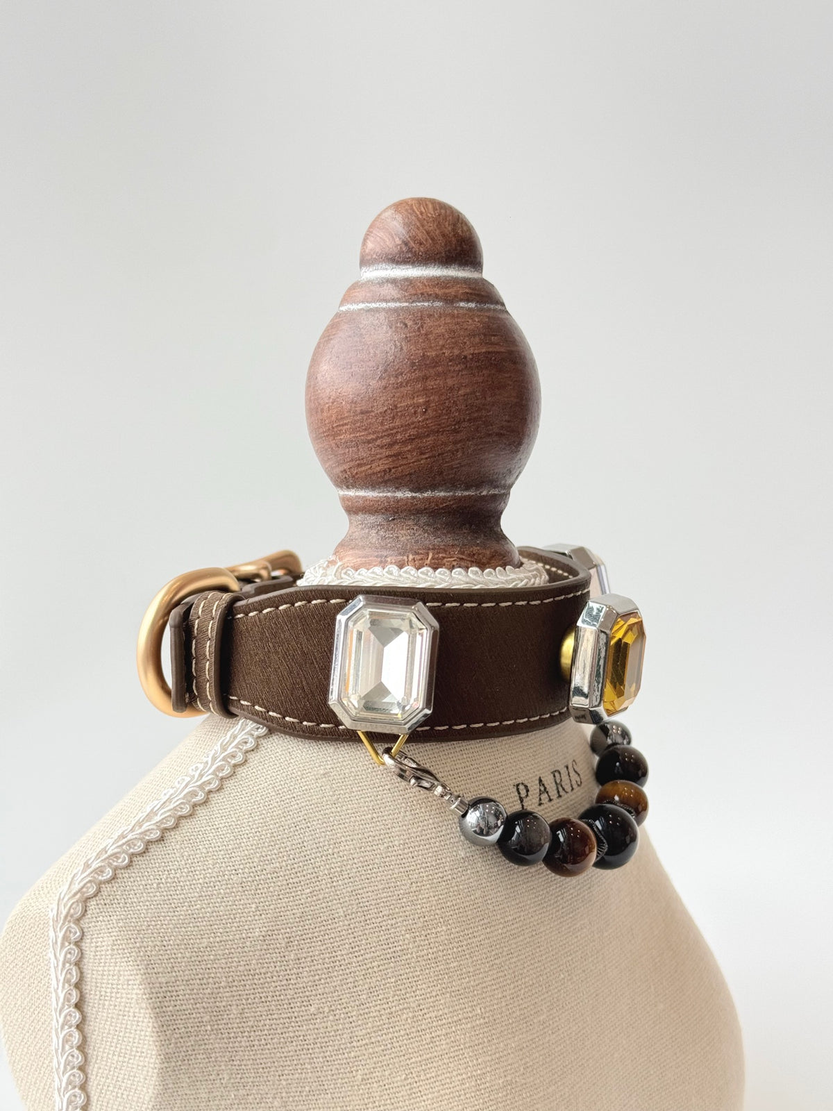 Pawlsle Trails Luxurious microfiber pet collar adorned with gemstones and a crystal bead chain; designed to be gentle on fur—perfect for photoshoots and festive occasions.