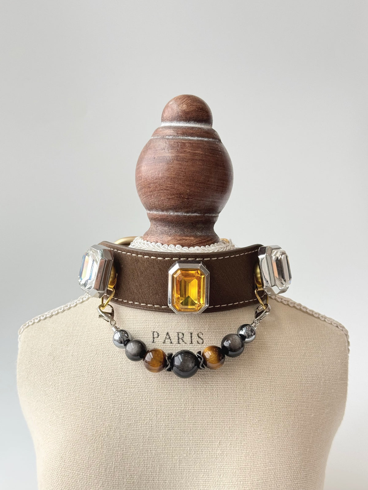 Pawlsle Trails Luxurious microfiber pet collar adorned with gemstones and a crystal bead chain; designed to be gentle on fur—perfect for photoshoots and festive occasions.