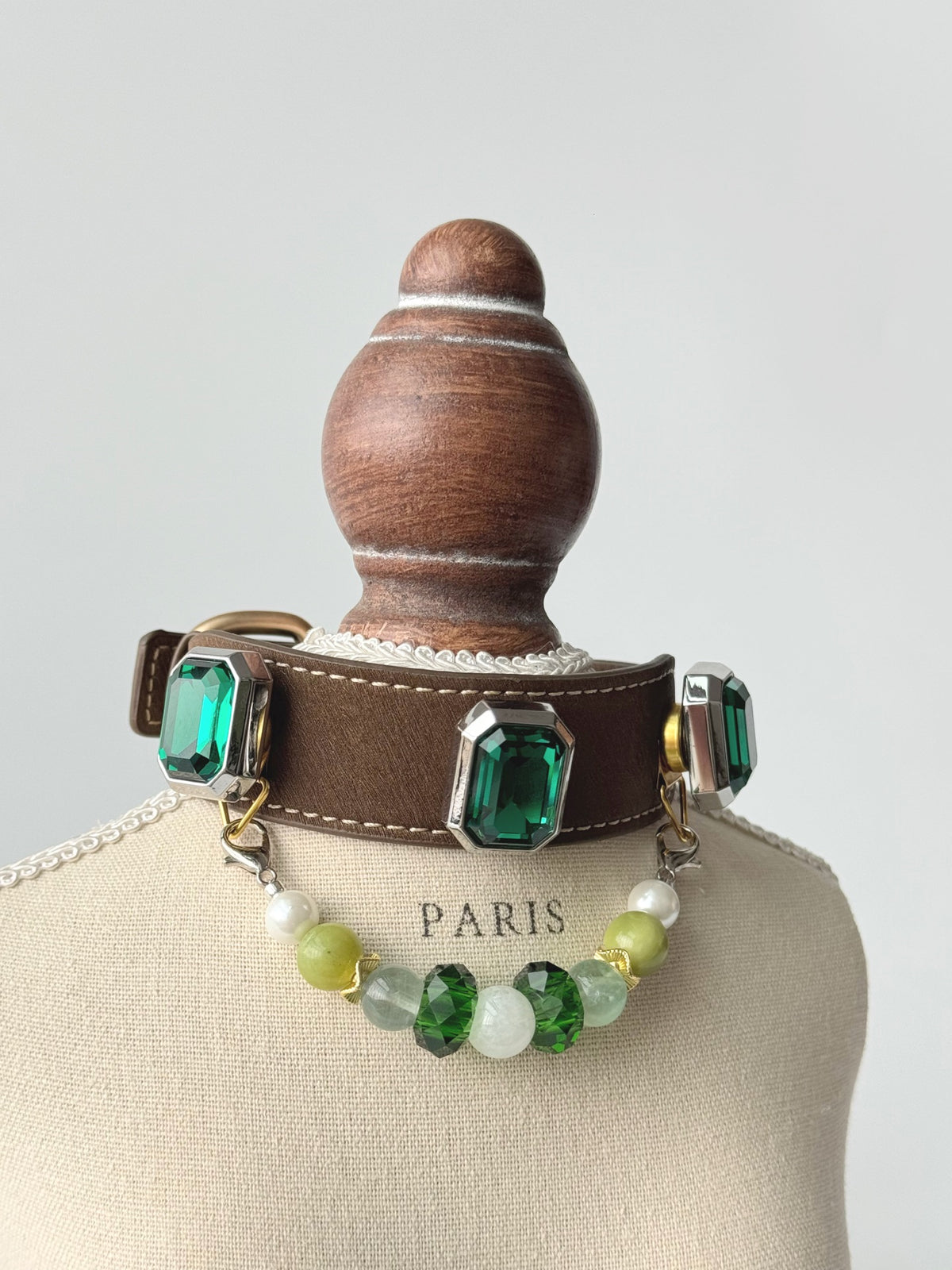 Pawlsle Trails Emerald-toned, gemstone-style microfiber leather pet collar featuring a detachable beaded chain; designed to be non-stick to fur, comfortable, and adjustable.
