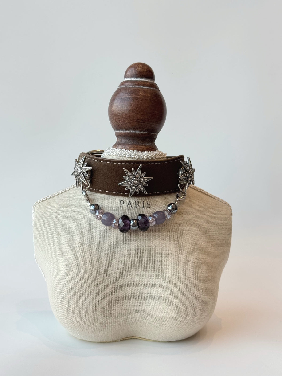 Pawlsle Trails "North Star" jeweled pet collar, crafted from brown microfiber leather and adorned with a rhinestone North Star emblem; features an interchangeable, hand-beaded gemstone chain. Suitable for cats as well as medium-to-large dogs. Style 2