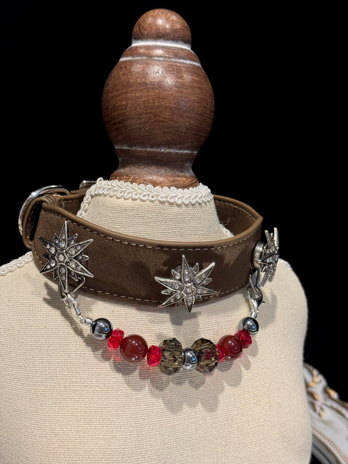 Pawlsle Trails "North Star" jeweled pet collar, crafted from brown microfiber leather and adorned with a rhinestone North Star emblem; features an interchangeable, hand-beaded gemstone chain. Suitable for cats as well as medium-to-large dogs.