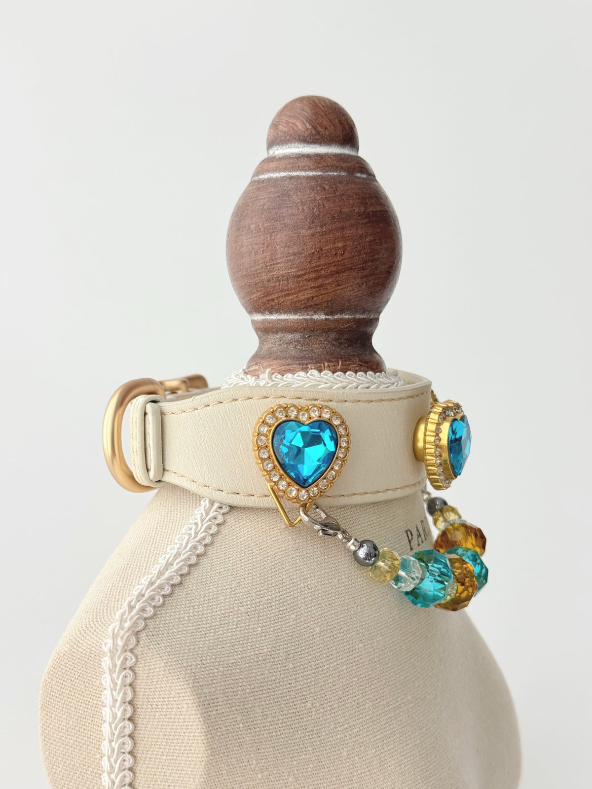 Pawlsle Trails Luxurious "Heart of the Ocean" crystal pet collar—an elegant white microfiber collar adorned with beaded gemstones.