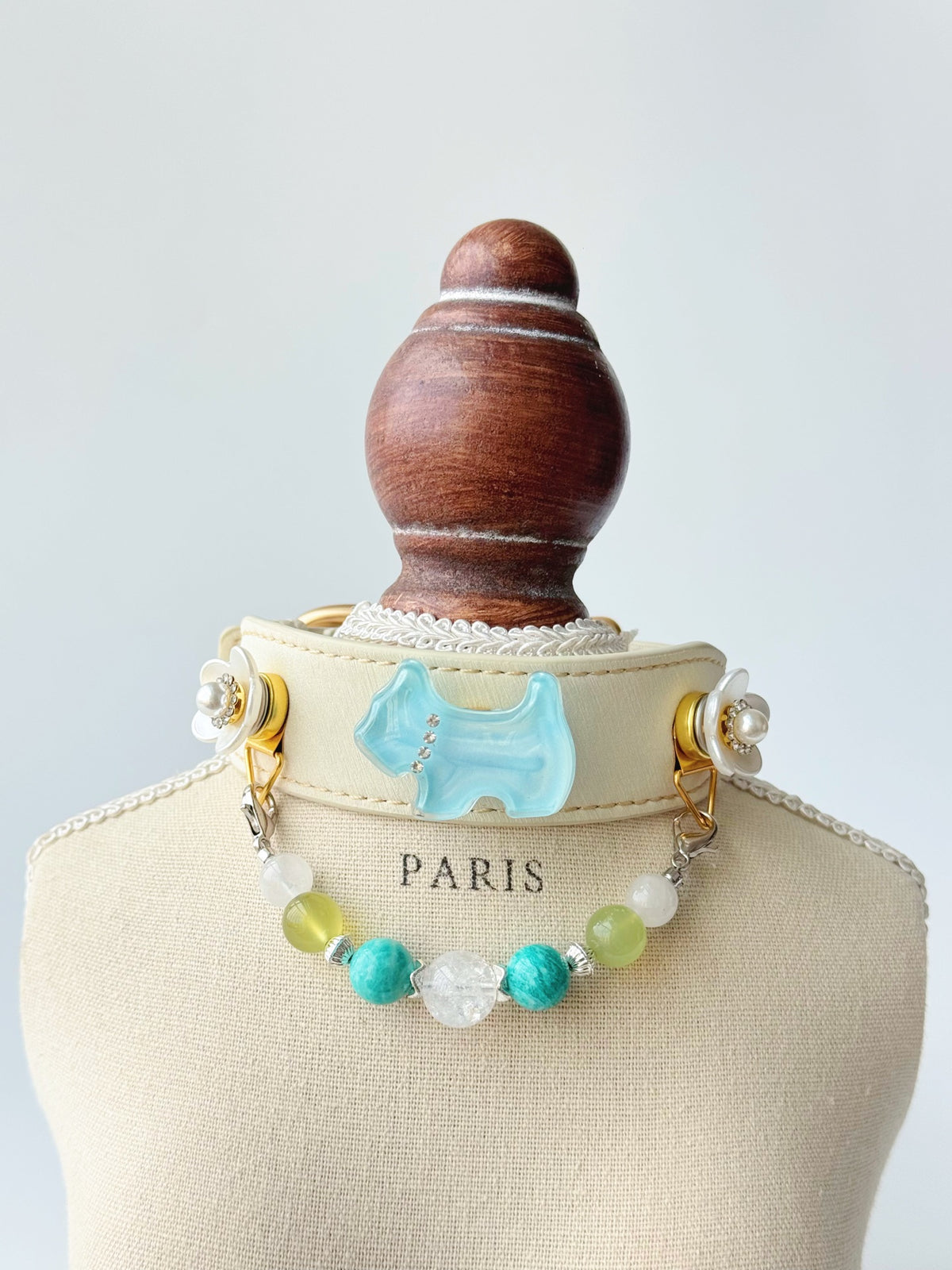 Pawlsle Trails Light blue dog collar, crafted from off-white microfiber leather and accented with a handmade natural gemstone chain; designed for a comfortable fit that won’t snag or pull on fur.