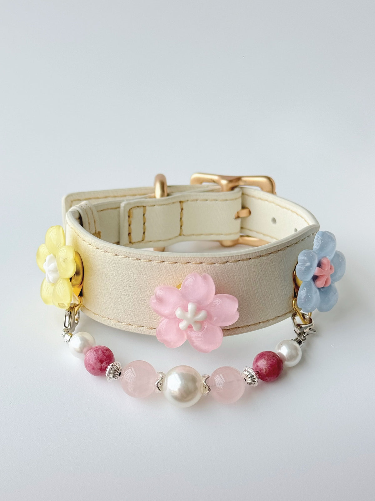 Pawlsle Trails Cherry blossom-themed pet collar set, featuring a beige microfiber leather collar adorned with a detachable, handcrafted chain of beaded gems—a floral-style accessory designed for cats as well as small, medium, and large dogs. Style 2