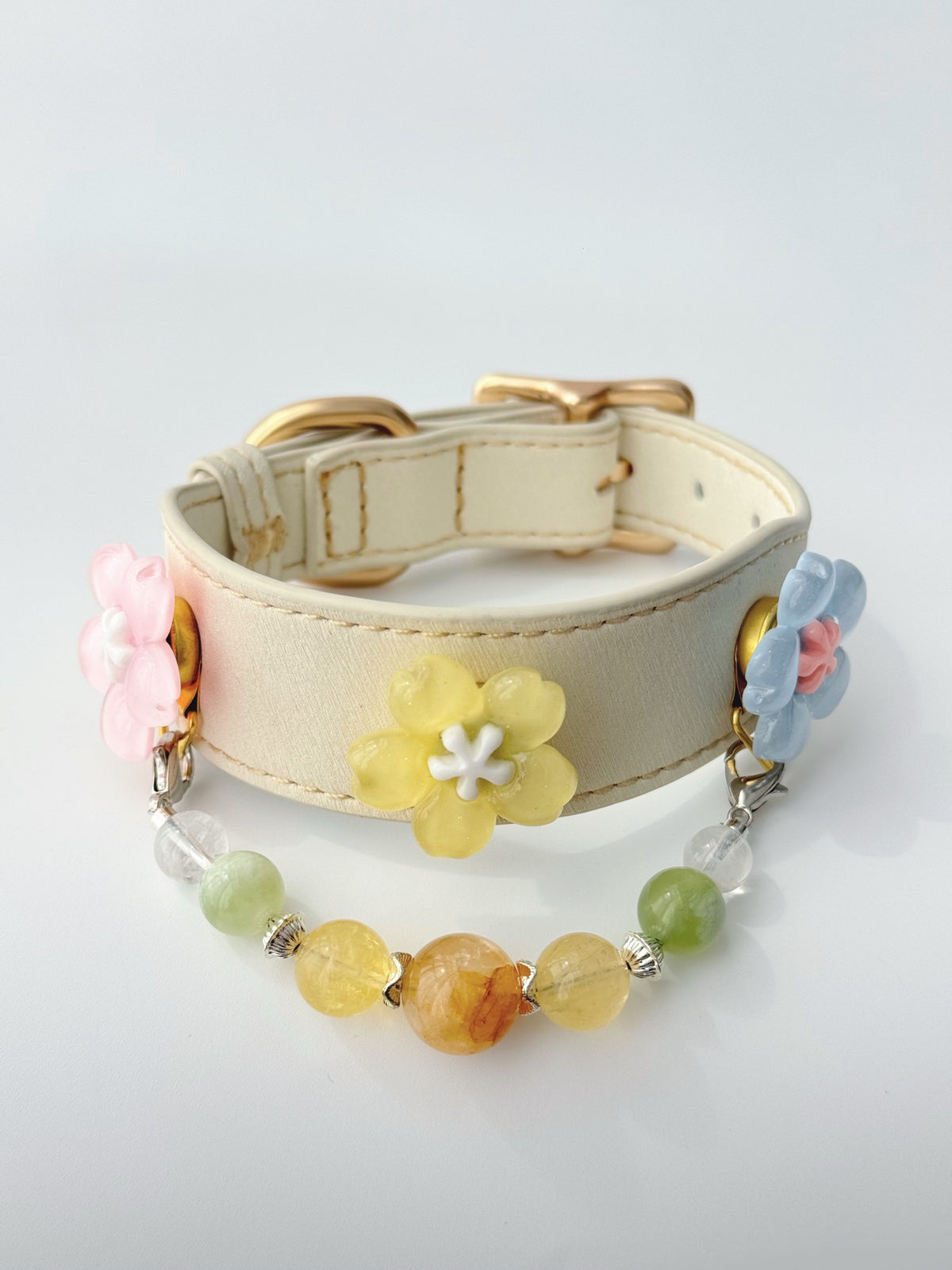 Pawlsle Trails Cherry blossom-themed pet collar set, featuring a beige microfiber leather collar adorned with a detachable, handcrafted chain of beaded gems—a floral-style accessory designed for cats as well as small, medium, and large dogs. Style 3