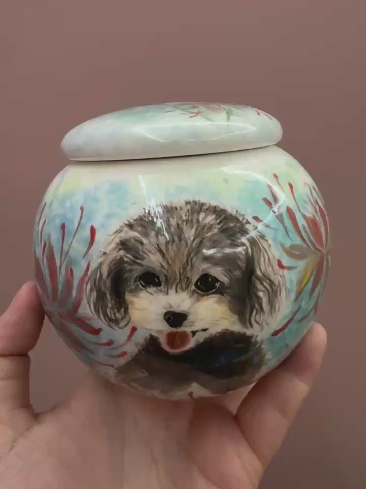 A variety of hand-painted pet urns