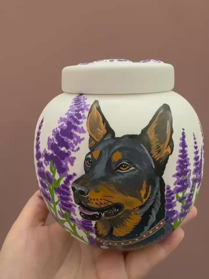 A variety of hand-painted pet urns