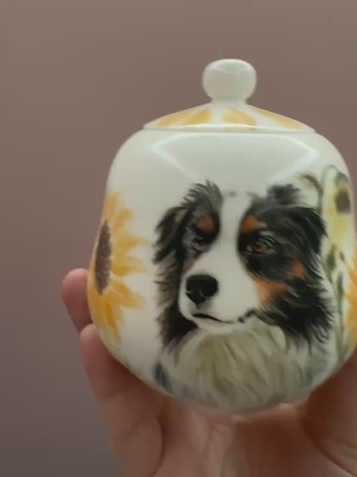 A variety of hand-painted pet urns